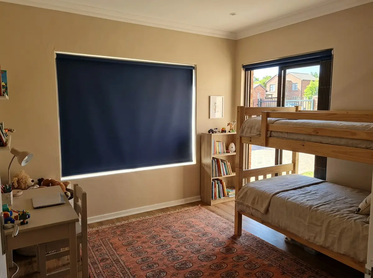 Bedroom with blockout blinds in a security-estate home, sand and terracotta palette